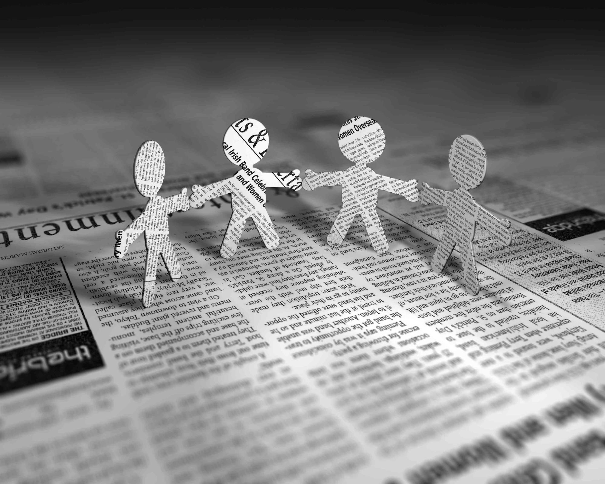 Paper figures representing people and communication